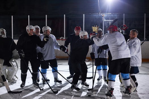 hockey players celebrating an assist