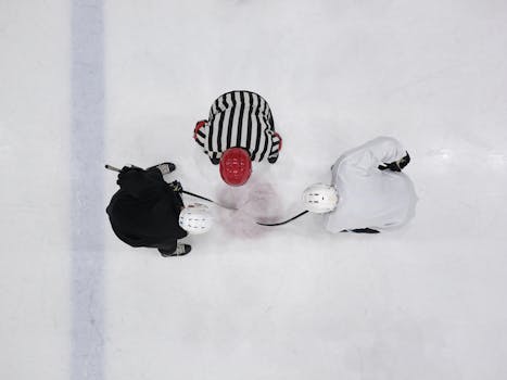 Hockey players strategizing during a game